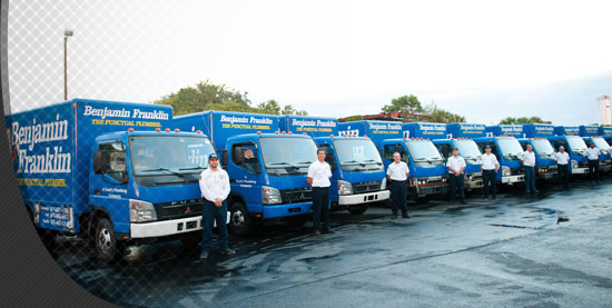 A fleet of Ben franklin plumber trucks